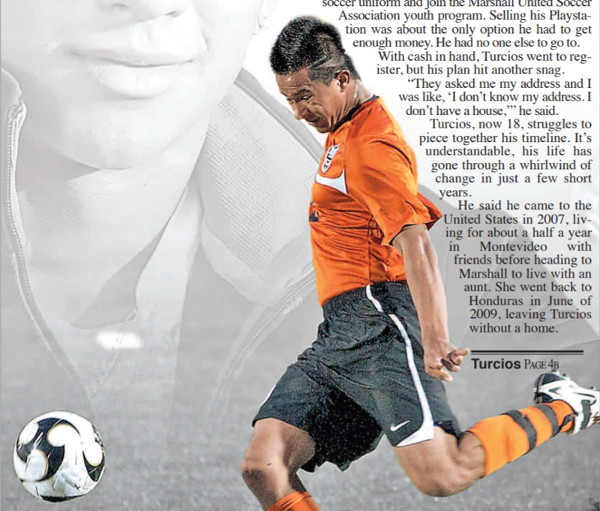 a young man kicking a soccer ball